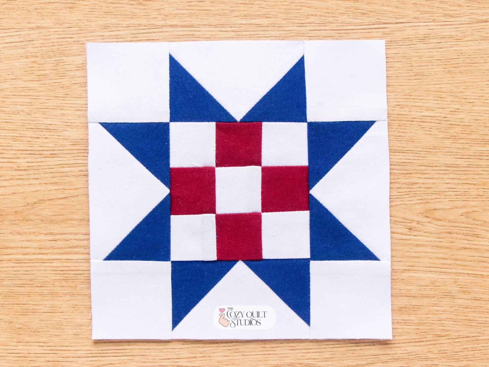 sawtooth star fpp quilt block with nine patch centre