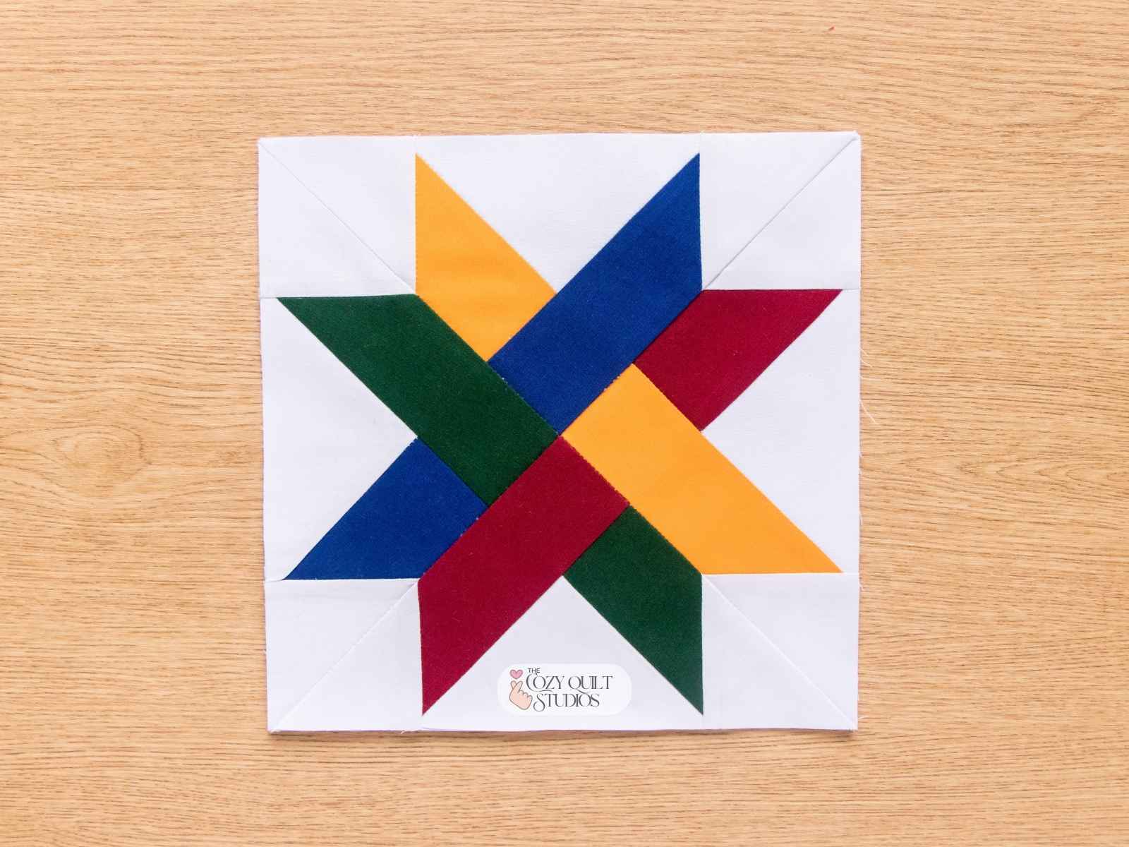 Finished Woven Star quilt block showing interlocking ribbon design no Y seams woven cross quilt block
